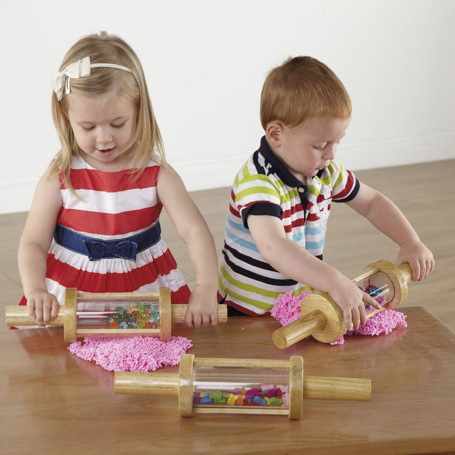 Set of wooden cylindrical rollers filled with items