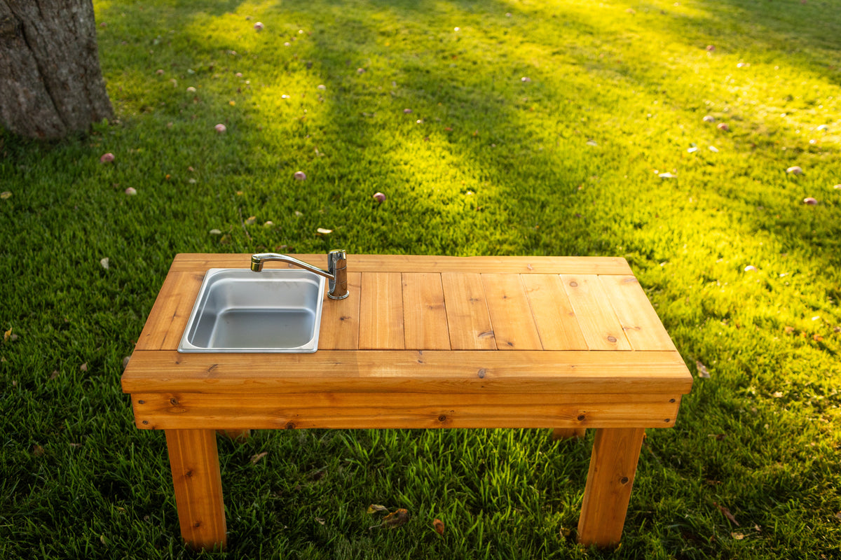 Cedar outdoor mud kitchen by Noble Wooden Toys with 1 stainless steel sink, optional faucet and shelf