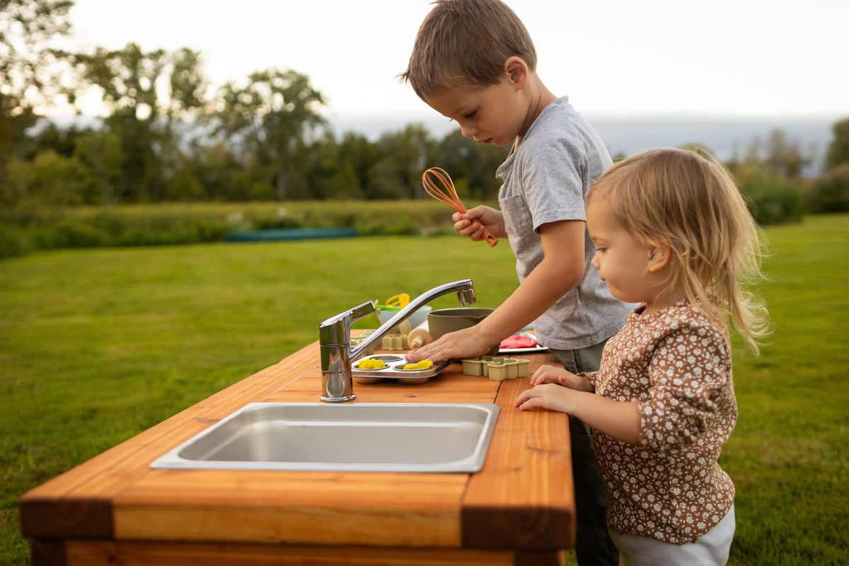 Cedar outdoor mud kitchen by Noble Wooden Toys with 1 stainless steel sink, optional faucet and shelf