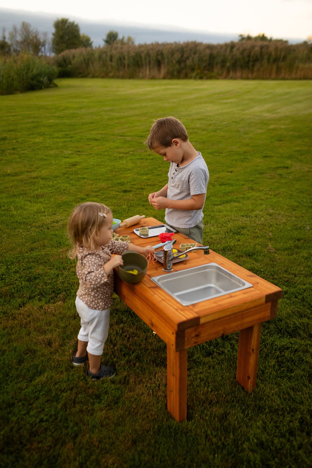 Cedar outdoor mud kitchen by Noble Wooden Toys with 1 stainless steel sink, optional faucet and shelf