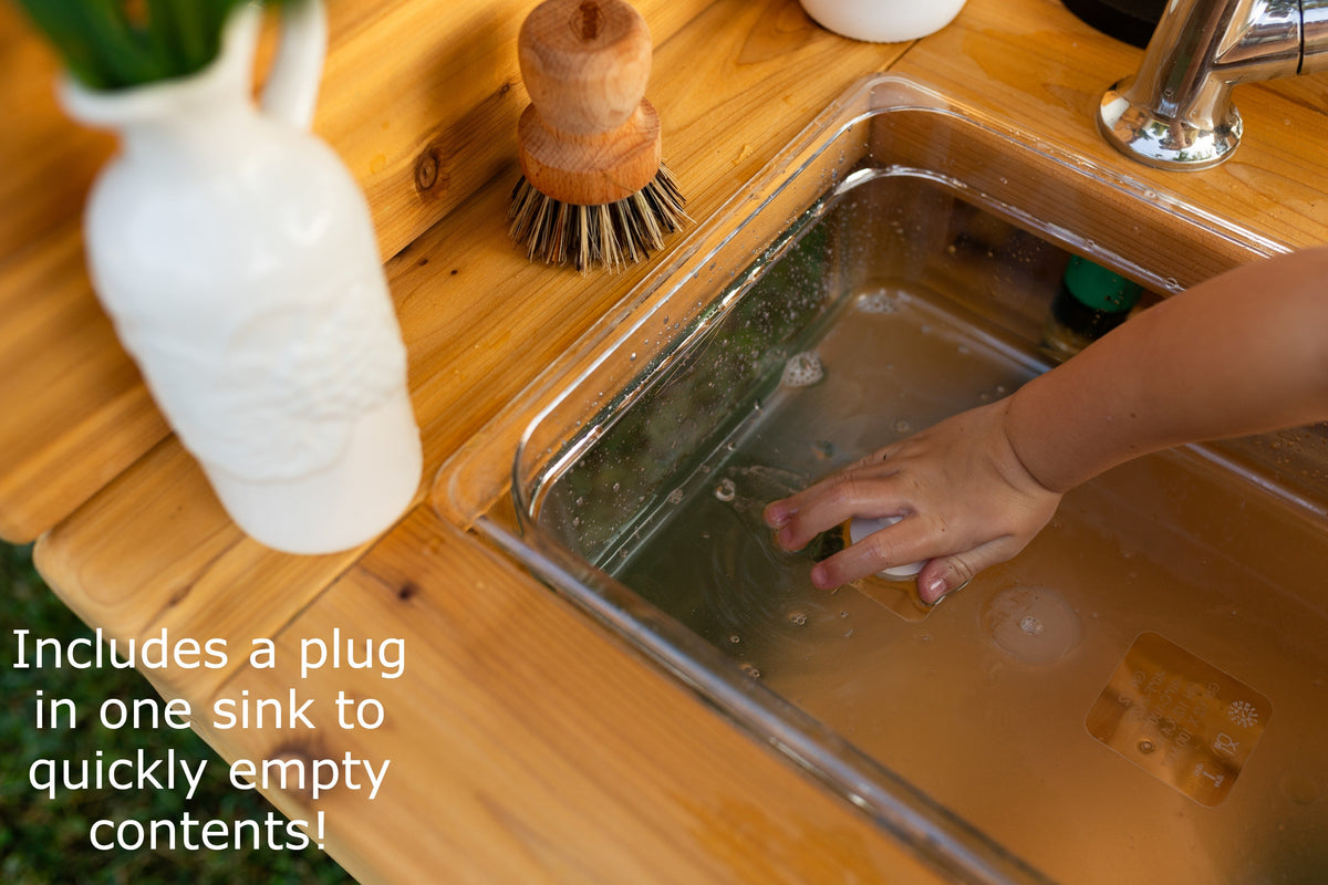 Cedar outdoor mud kitchen by Noble Wooden Toys with oven, stovetop, working faucet and 2 centred clear sinks