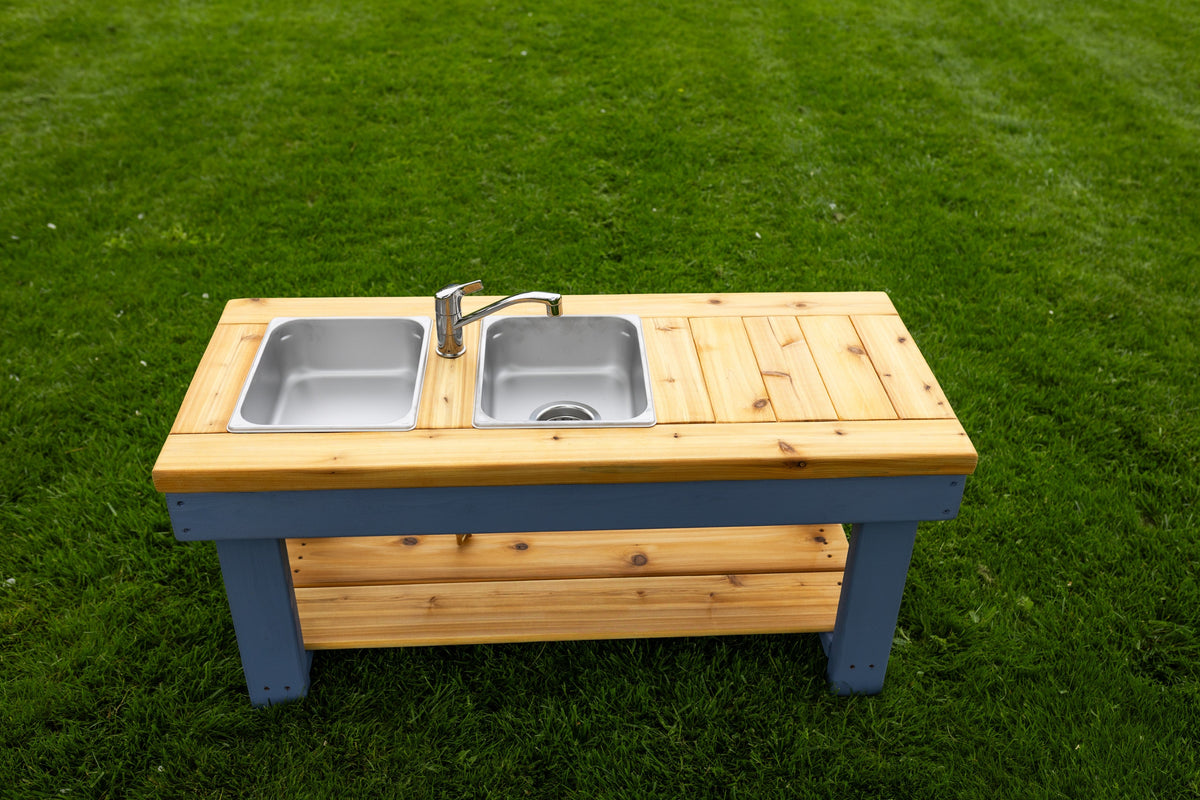 Simple painted cedar outdoor mud kitchen by Noble Wooden Toys with shelf and 2 stainless steel sinks