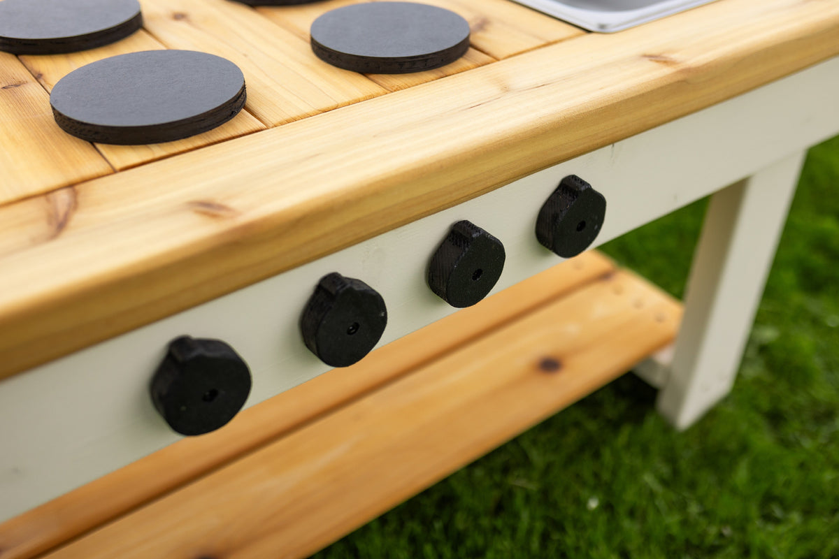 Simple painted cedar outdoor mud kitchen by Noble Wooden Toys with shelf and 2 centred stainless steel sinks