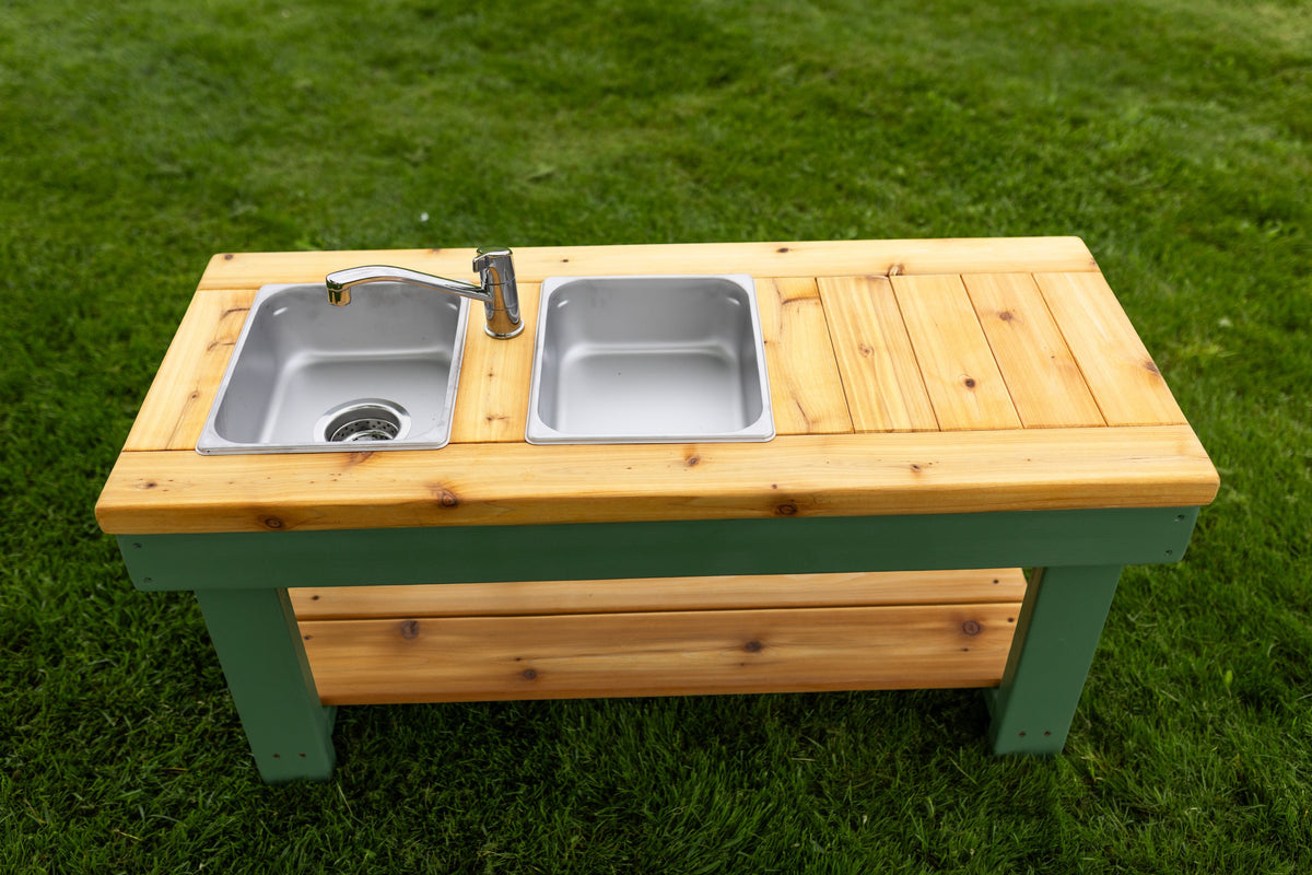 Simple painted cedar outdoor mud kitchen by Noble Wooden Toys with shelf and 2 stainless steel sinks
