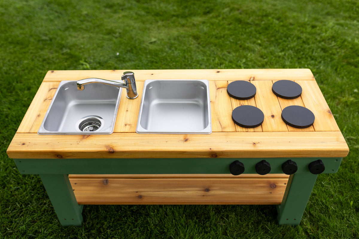 Simple painted cedar outdoor mud kitchen by Noble Wooden Toys with shelf and 2 stainless steel sinks