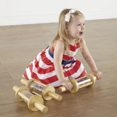 Set of wooden cylindrical rollers filled with items