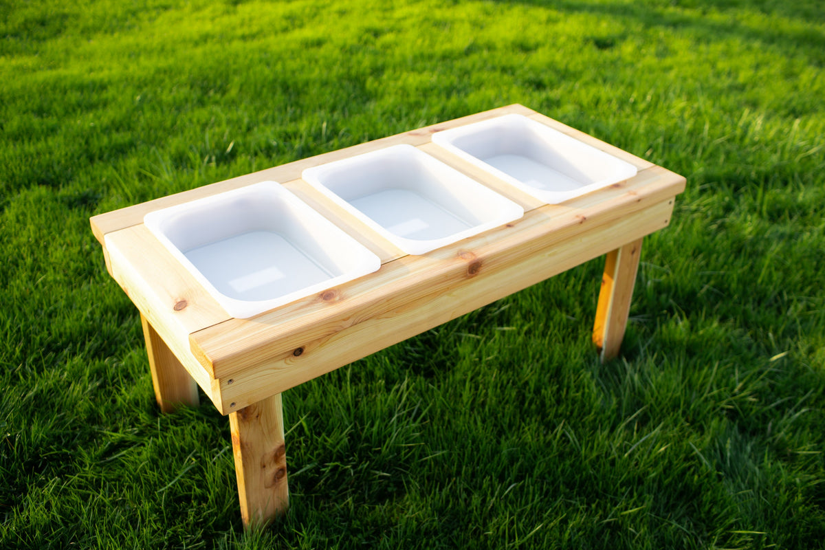 Indoor and outdoor cedar sensory table with 3 bins by Noble Wooden Toys, 45.5 in.