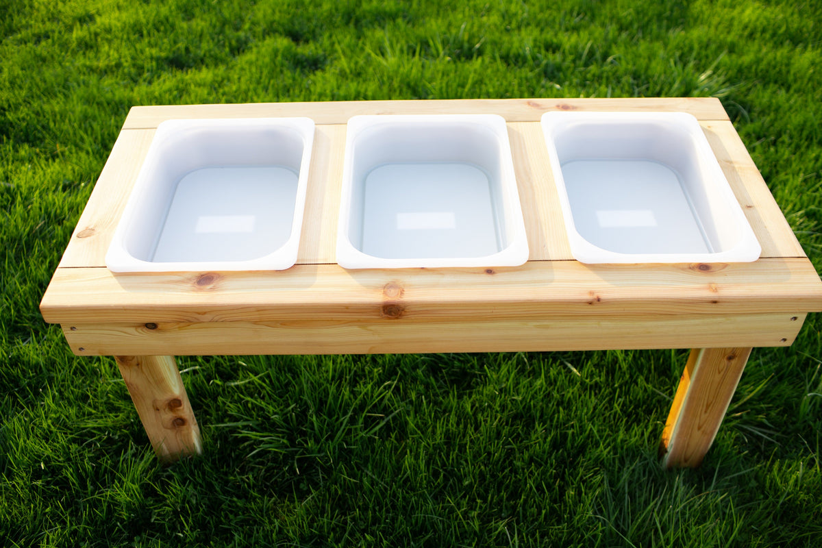 Indoor and outdoor cedar sensory table with 3 bins by Noble Wooden Toys, 45.5 in.