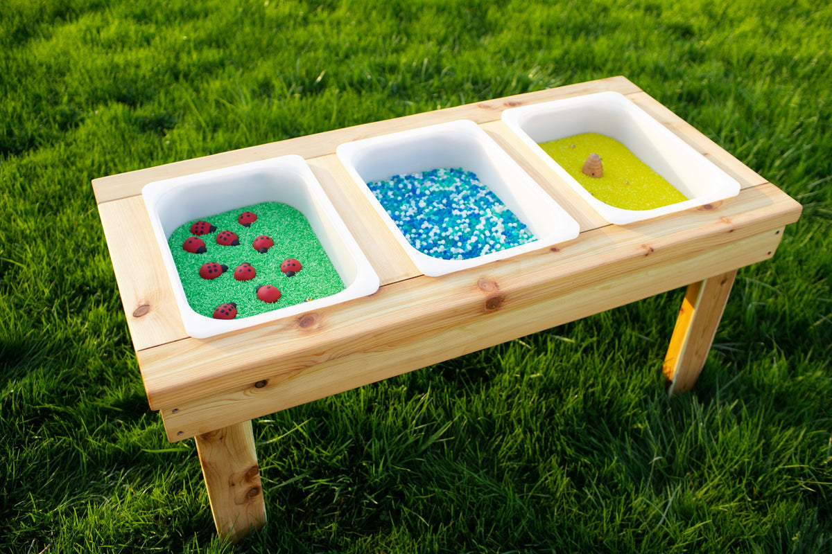 Indoor and outdoor cedar sensory table with 3 bins by Noble Wooden Toys, 45.5 in.