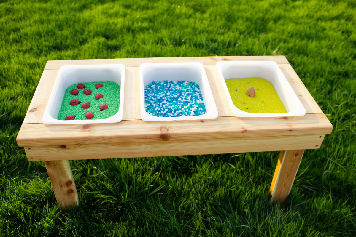 Indoor and outdoor cedar sensory table with 3 bins by Noble Wooden Toys, 45.5 in.