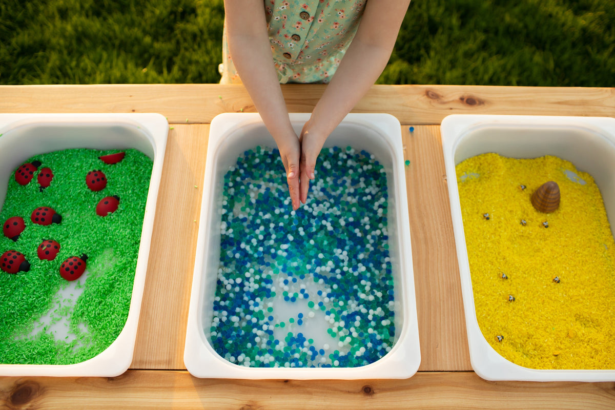 Indoor and outdoor cedar sensory table with 3 bins by Noble Wooden Toys, 45.5 in.