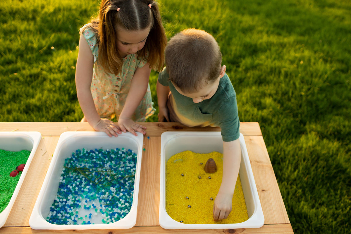 Indoor and outdoor cedar sensory table with 3 bins by Noble Wooden Toys, 45.5 in.