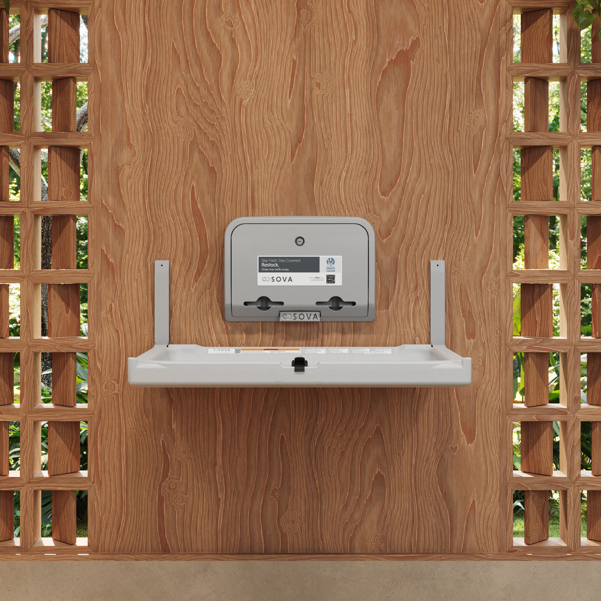 Distributeur de protège-tables Element gris pâle installé au-dessus d'une table à langer murale Element